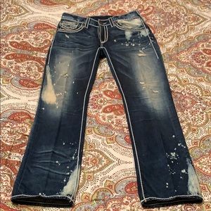 Big Stitching Ripped & Faded True Religion Jeans.